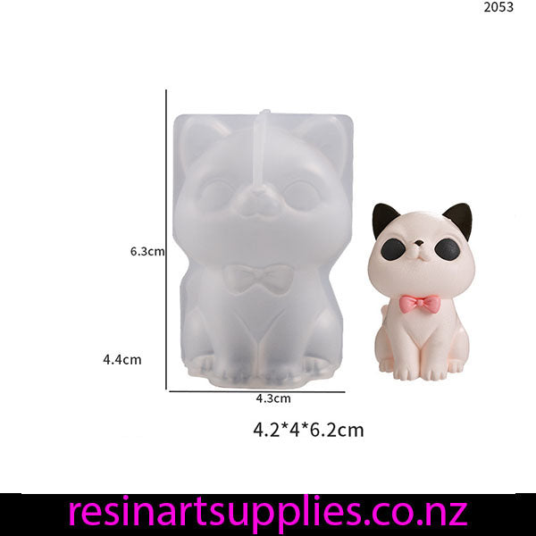 Puppy-shaped silicone mold with dimensions and a small puppy figurine on a white background.