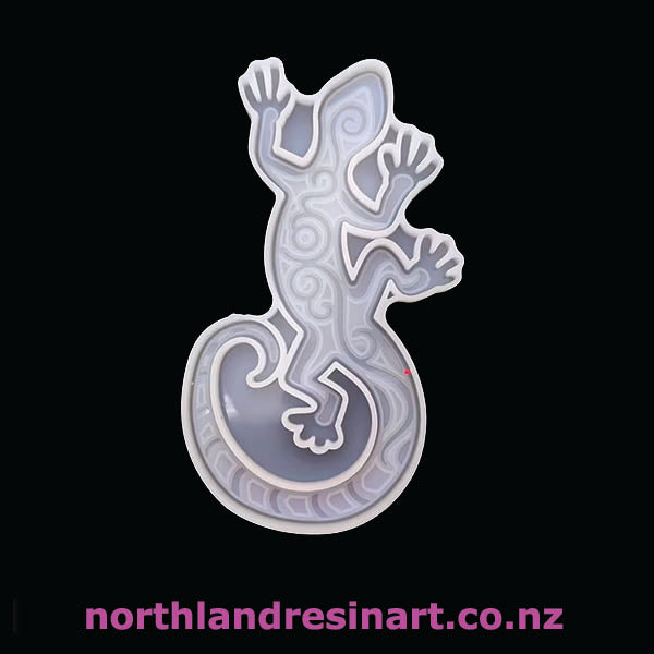 Decorative resin art piece of a lizard on a black background with 'northlandresinart.co.nz' text.