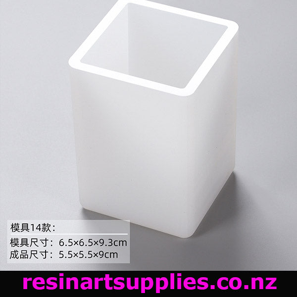 White resin mold in the shape of a square with rounded edges on a gray background, featuring text and a brand name.