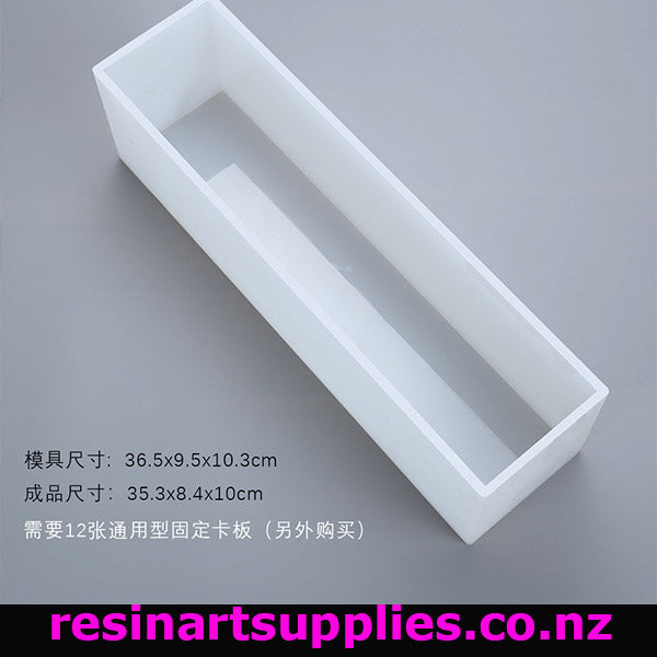 Rectangular white silicone mold on a gray background with text and branding.
