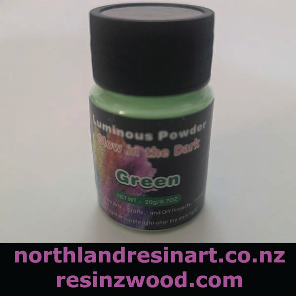 Bottle of green luminous powder with black cap on a white background, featuring website URLs.