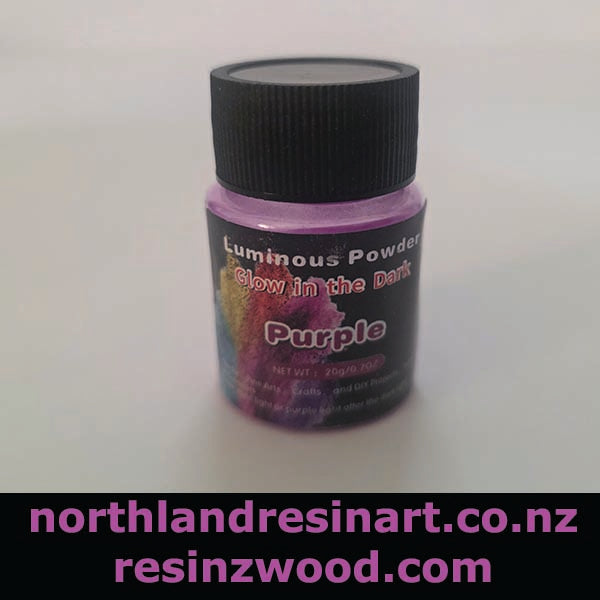 Bottle of purple glow in the dark powder with a black lid on a white background, featuring website URLs at the bottom.