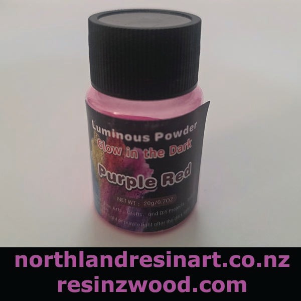 Bottle of Luminous Powder with purple and red glow in the dark properties on a white background.