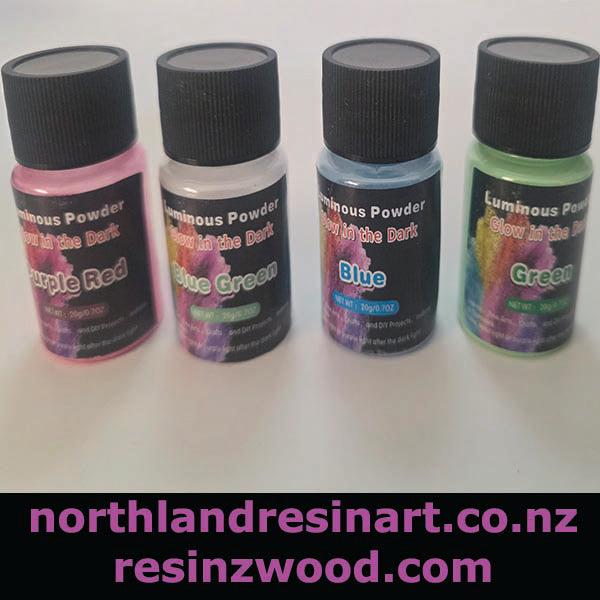 Four bottles of Luminous Powder with colorful labels on a white background, featuring the brand 'northlandresinart.co.
