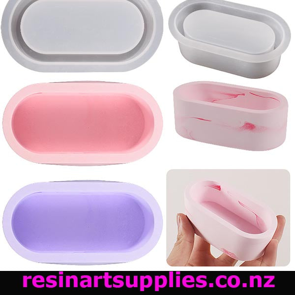 Collage of silicone molds in various colors with a hand holding one pink mold.