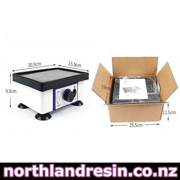 A square Bubble remover vibration table with a black top surface and white body, shown alongside its open cardboard packaging. Dimension lines indicate the product measurements, and the text 'northlandresinart.co.nz'