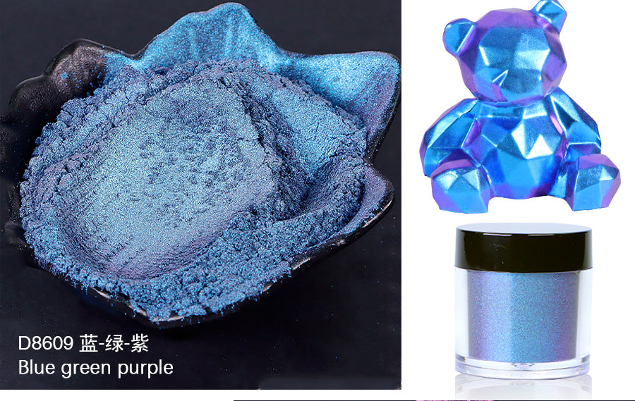 Blue green purple powder in a container with a decorative blue figure on a black background