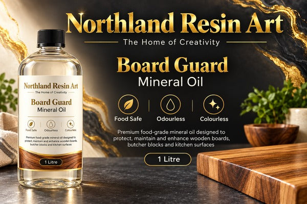 A 1 litre bottle of Northland Resin Art Board Guard Mineral Oil displayed on a dark wooden surface with a wooden cutting board and kitchen plants in the background. The image features promotional text highlighting its food safe, odourless, and colourless qualities.
