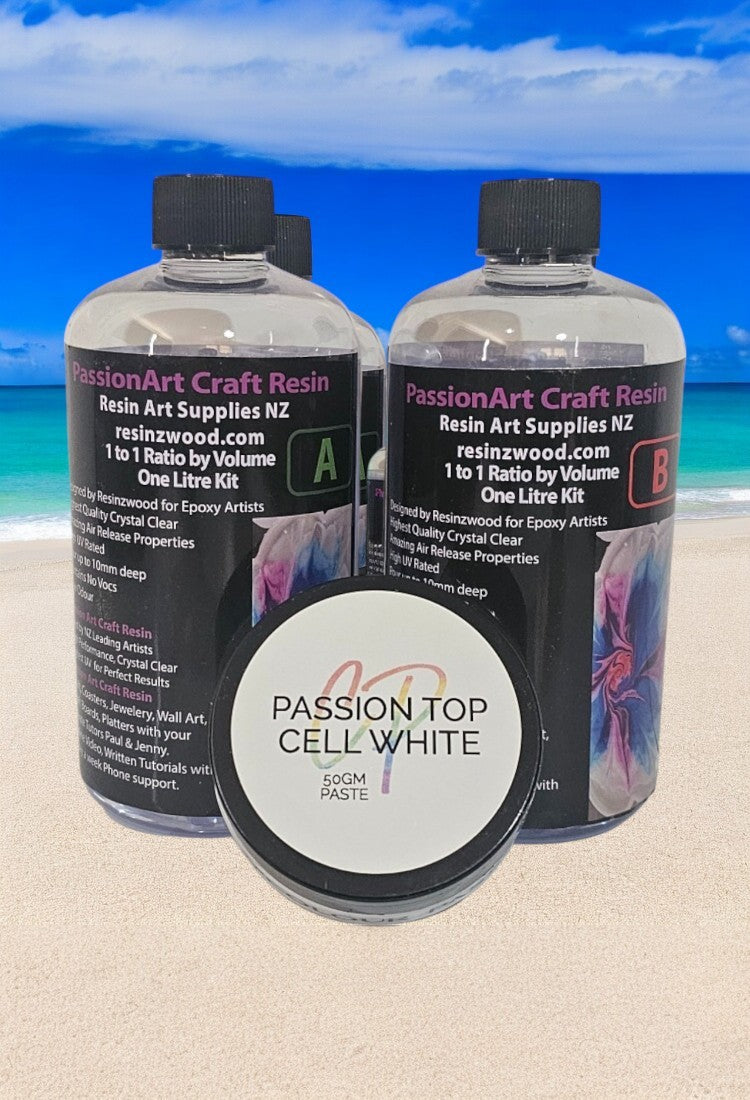 This image contains two bottles of Epoxy Art Resins NZ, on a beach scene background that includes ocean and sky.