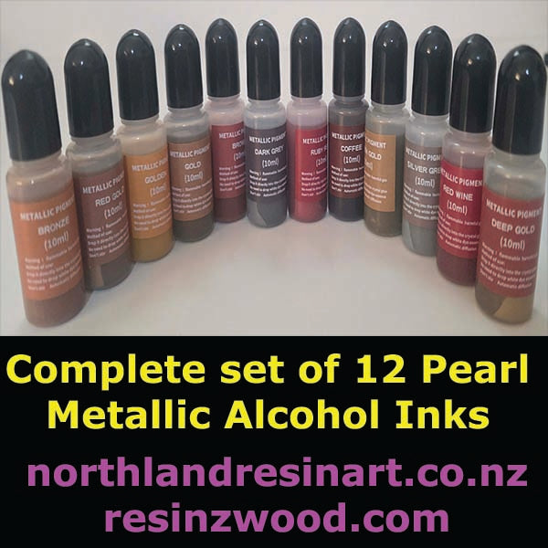 Set of 12 pearl metallic alcohol inks with labels on a white background