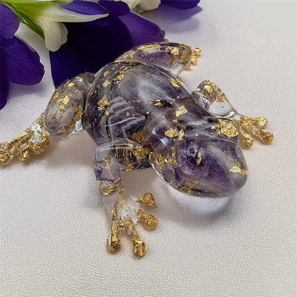 Amethyst quartz crystal frog-shaped decorated with gold Leaf and gold branch details.