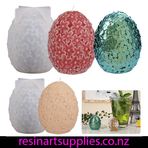 Set of decorative resin molds with floral patterns and a glass of iced tea.