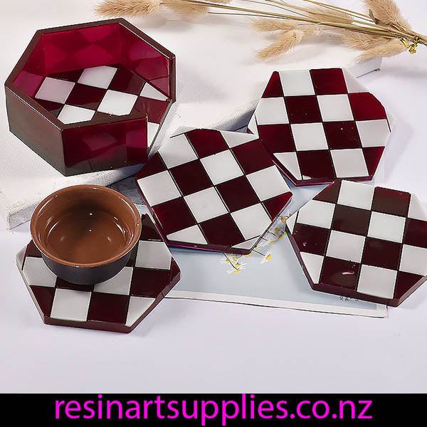 Hexagonal checkered coasters with a bowl on a white surface, featuring 'resinartsupplies.co.nz'.