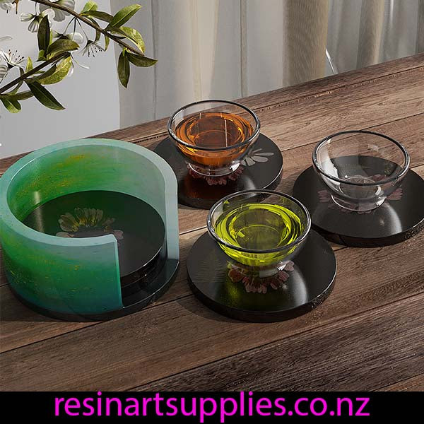 Resin coaster stand on a wooden surface, with 'resinartsupplies.co.nz' branding.