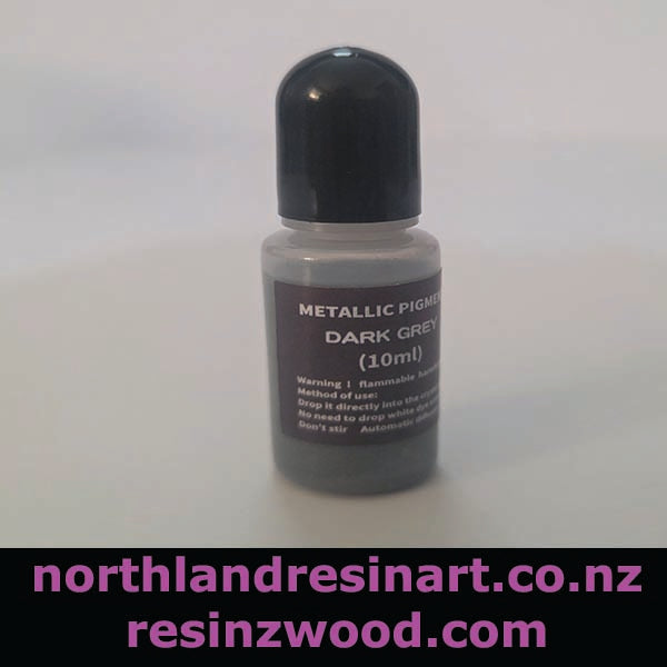 Bottle of metallic pigment dark grey with a black cap on a white background, featuring website text at the bottom.