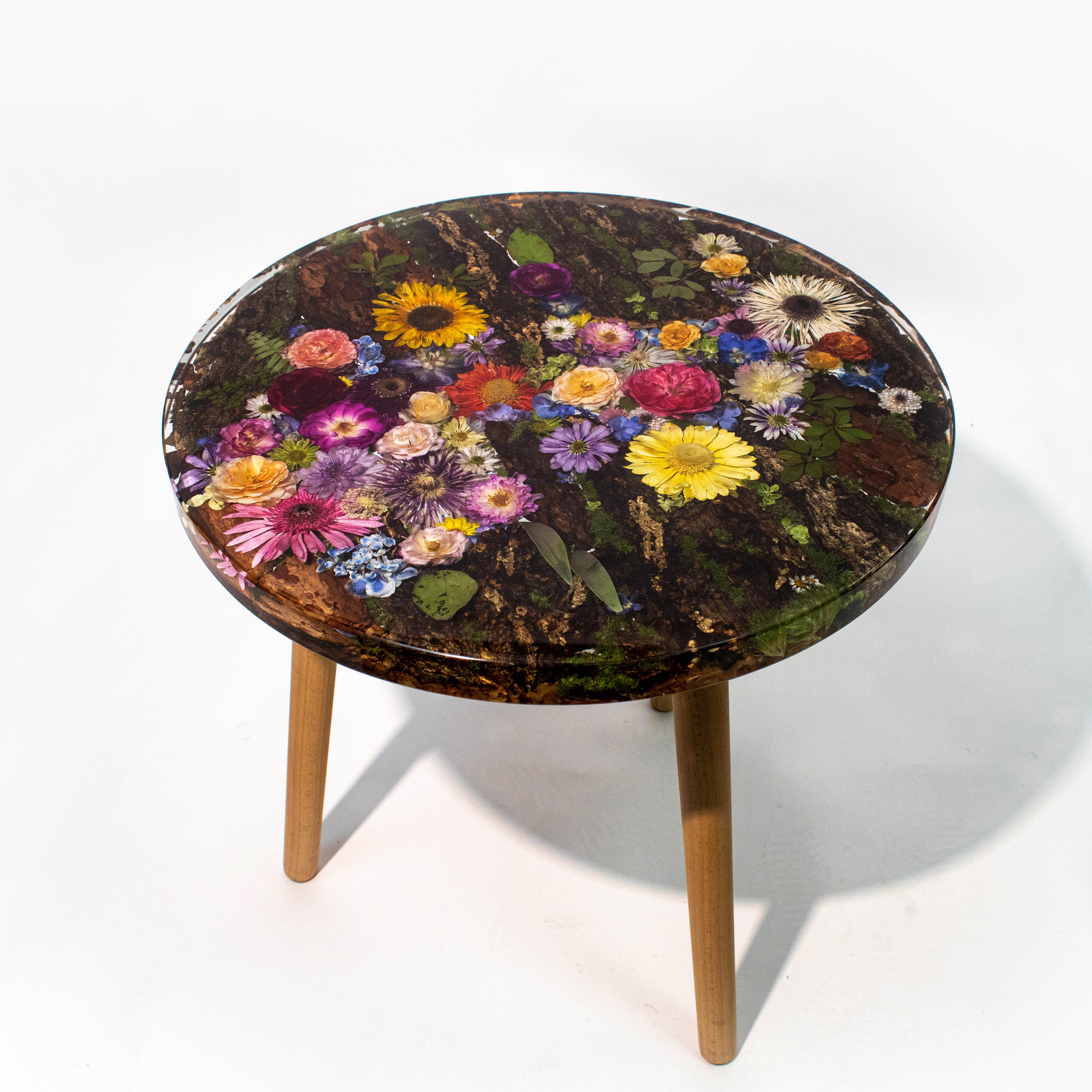 Round table with a floral design on a white background