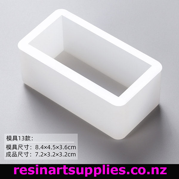 Rectangular white silicone mold on a gray background with text and brand name.