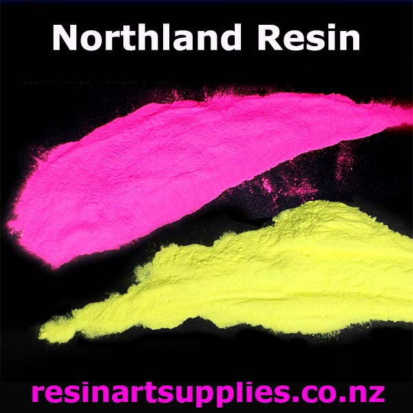 Pink and yellow powders with 'Northland Resin' branding on a black background.
