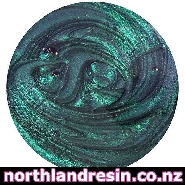 Close-up of green and blue swirled slime with 'northlandresin.co.nz' branding.