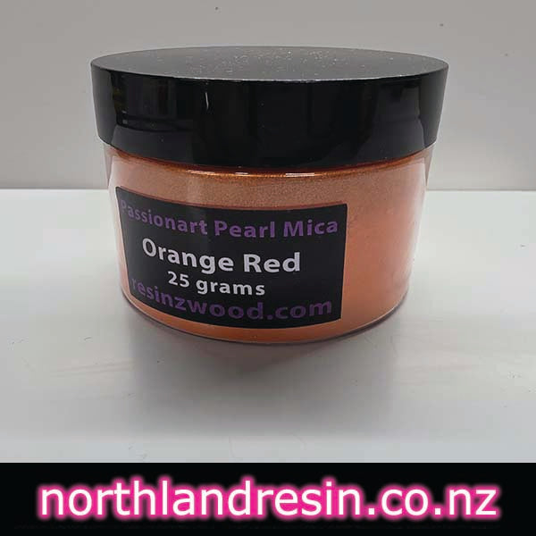 Jar of orange red pearl mica with a black lid on a white background, featuring 'northlandresin.co.nz' text.