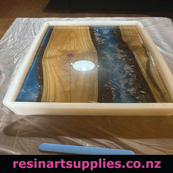 Wooden tray with resin finish on a white surface, branded 'resinartsupplies.co.nz'.
